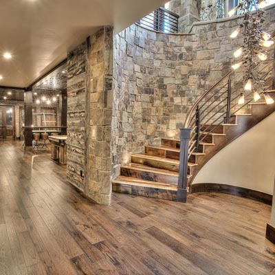 Ottawa Stair Builder custom hardwood treads with box newel posts and horizontal metal balusters, and steel balustrade